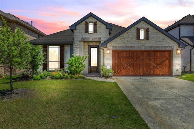 3005 Knoxbridge Rd, Forney, TX 75126 - french country inspired facade with stone siding, concrete driveway, a front yard, an attached garage, and a shingled roof