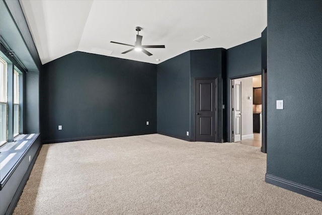 3005 Knoxbridge Rd, Forney, TX 75126 - spare room featuring a ceiling fan, light carpet, vaulted ceiling, and baseboards