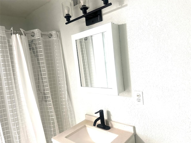 3024 Carnation Ave, Fort Worth, TX 76111 - bathroom with a sink and a shower with shower curtain