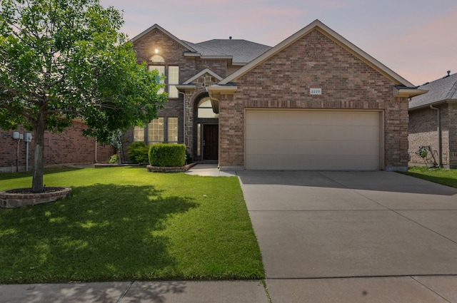 2220 Frosted Willow Ln, Fort Worth, TX 76177 - traditional-style home with an attached garage, driveway, a front lawn, and brick siding