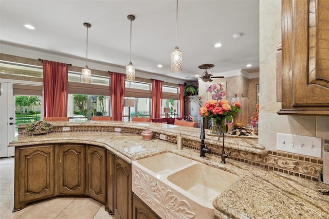 100 Country Club Dr, Heath, TX 75032 - kitchen with a sink, recessed lighting, ceiling fan, pendant lighting, and light stone counters