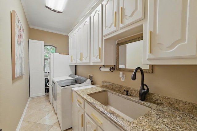 100 Country Club Dr, Heath, TX 75032 - laundry room featuring washing machine and clothes dryer, cabinet space, baseboards, light tile patterned floors, and ornamental molding