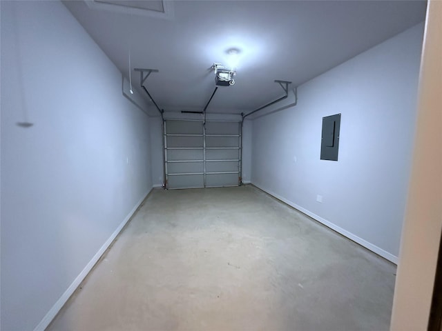 729 E Sears St, Denison, TX 75021 - garage with electric panel, a garage door opener, and baseboards