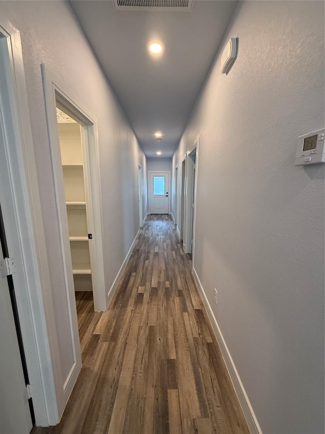 729 E Sears St, Denison, TX 75021 - hallway featuring dark wood-style floors and baseboards