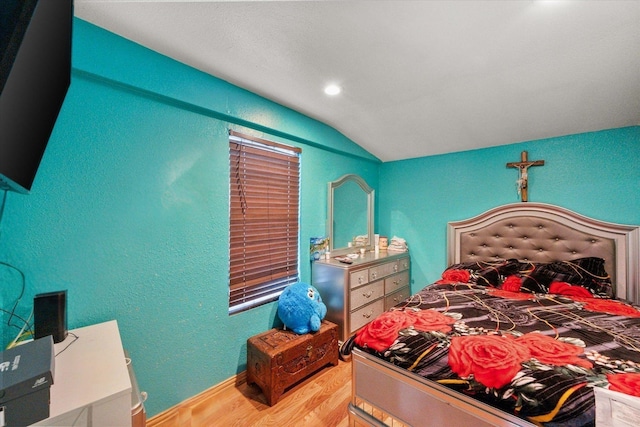 1017 S Newark Ave, Fort Worth, TX 76105 - bedroom featuring light wood-type flooring, vaulted ceiling, a textured wall, recessed lighting, and baseboards