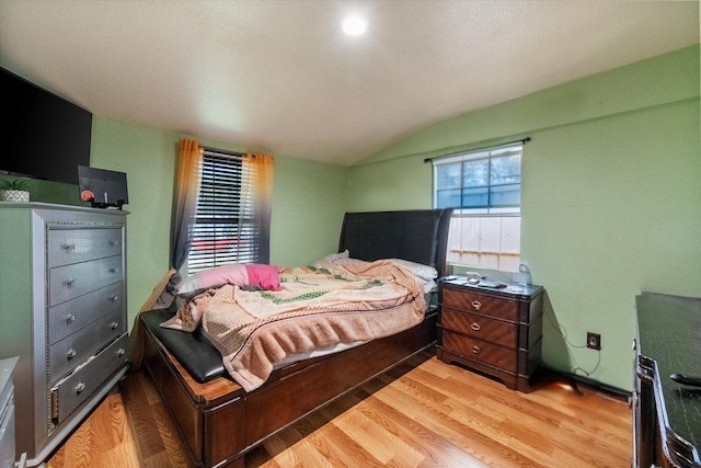 1017 S Newark Ave, Fort Worth, TX 76105 - bedroom featuring wood finished floors and vaulted ceiling