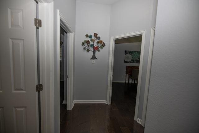 107 Harvest Way, Crandall, TX 75114 - corridor featuring dark wood-style floors and baseboards