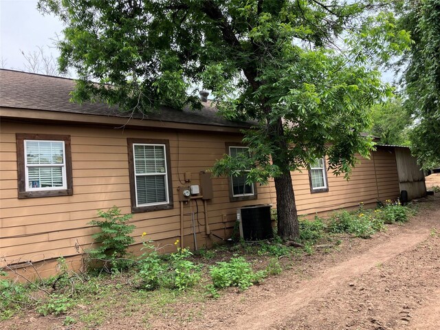 4531 Blackstone Dr, Fort Worth, TX 76114 - view of home's exterior featuring roof with shingles and central AC
