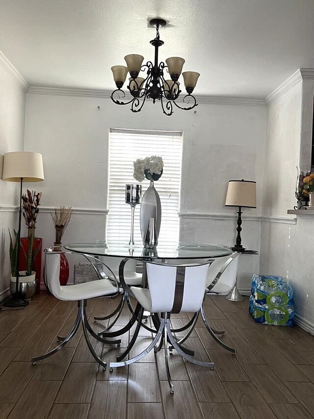 4531 Blackstone Dr, Fort Worth, TX 76114 - dining room featuring a chandelier, wood finish floors, ornamental molding, and baseboards