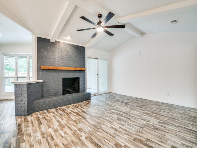 3906 Westview Dr, Rowlett, TX 75088 - unfurnished living room with wood finished floors, a fireplace, a ceiling fan, and baseboards