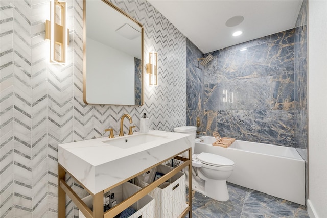13156 Burninglog Ln, Dallas, TX 75243 - full bath featuring marble look tiles, toilet, bathtub / shower combination, vanity, and recessed lighting