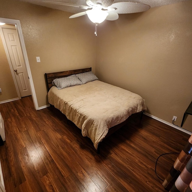 611 N Lamar St, Tioga, TX 76271 - bedroom with wood finished floors, baseboards, and ceiling fan