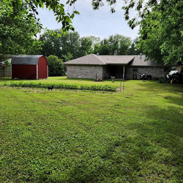 611 N Lamar St, Tioga, TX 76271 - view of grassy yard featuring an outbuilding and a storage shed