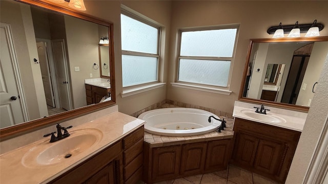 124 Heritage Pkwy W, Decatur, TX 76234 - full bath with a tub with jets, tile patterned floors, and two vanities