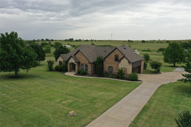 124 Heritage Pkwy W, Decatur, TX 76234 - french provincial home featuring stone siding, a front yard, driveway, and a shingled roof