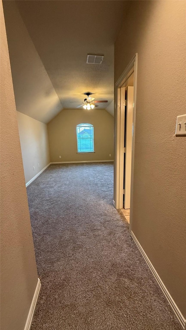 124 Heritage Pkwy W, Decatur, TX 76234 - additional living space featuring lofted ceiling, carpet flooring, baseboards, and ceiling fan