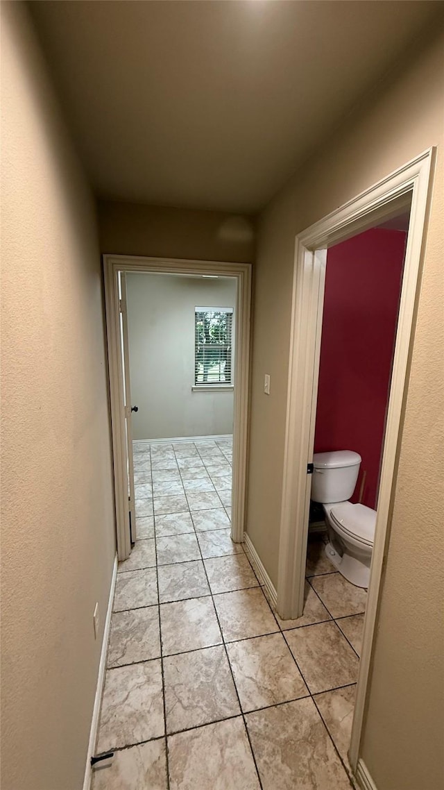 124 Heritage Pkwy W, Decatur, TX 76234 - hall with light tile patterned floors and baseboards