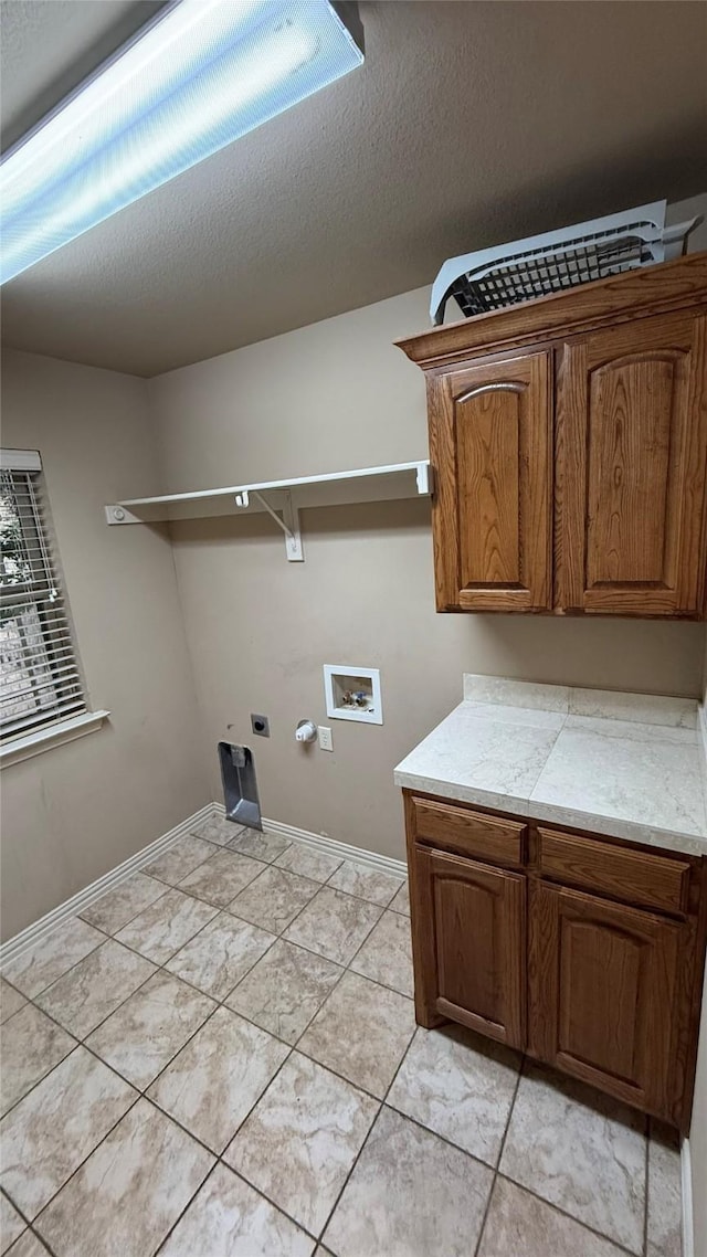 124 Heritage Pkwy W, Decatur, TX 76234 - washroom featuring hookup for an electric dryer, cabinet space, hookup for a washing machine, and baseboards