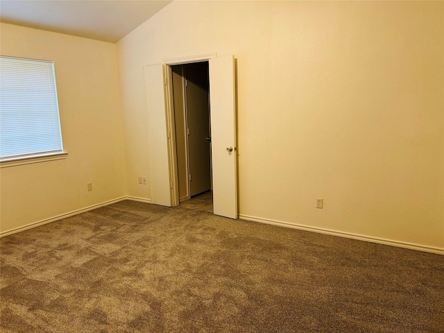 601 Lawrence Ave, Terrell, TX 75160 - empty room featuring vaulted ceiling and carpet flooring