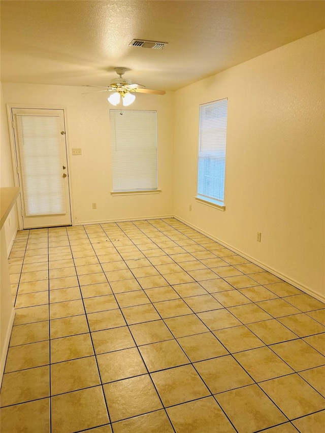 601 Lawrence Ave, Terrell, TX 75160 - empty room featuring ceiling fan, light tile patterned floors, and baseboards