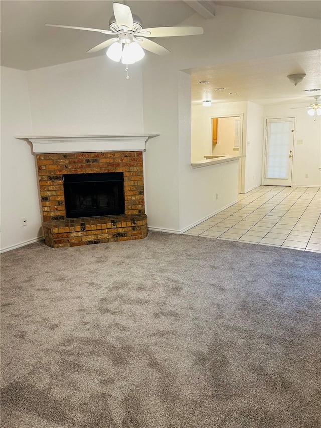 601 Lawrence Ave, Terrell, TX 75160 - unfurnished living room featuring a ceiling fan, carpet floors, a fireplace, tile patterned floors, and baseboards