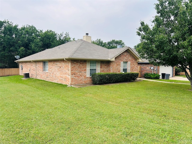 601 Lawrence Ave, Terrell, TX 75160 - view of property exterior with central air condition unit, a chimney, and brick siding