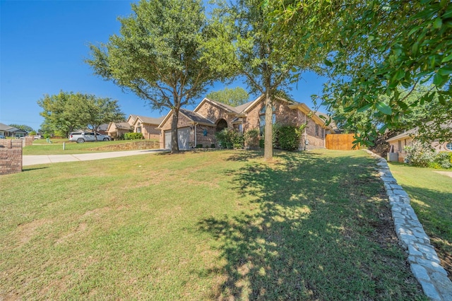 2113 Old Foundry Rd, Weatherford, TX 76087 - view of front facade with brick siding, concrete driveway, and a garage