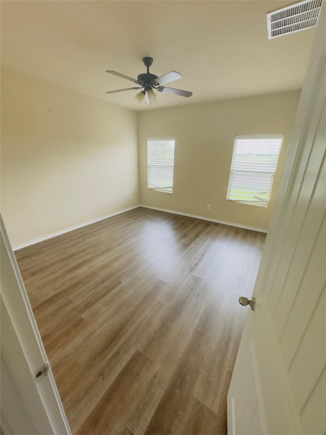 1129 Autumnwood Dr, Azle, TX 76020 - unfurnished room featuring wood finished floors, baseboards, and ceiling fan