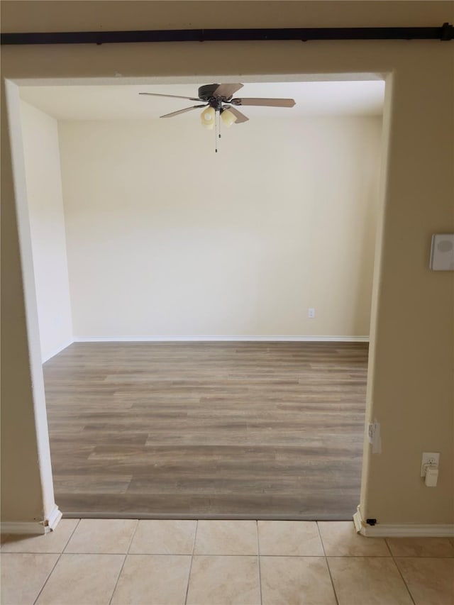 1129 Autumnwood Dr, Azle, TX 76020 - empty room with ceiling fan, wood finished floors, and baseboards