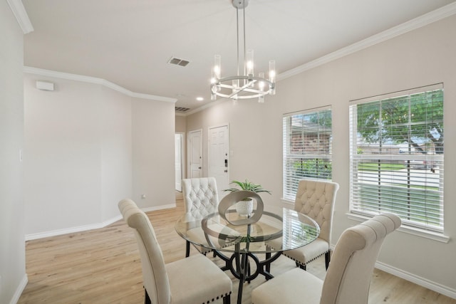 12350 Orloff Dr, Rhome, TX 76078 - dining room featuring light wood-style floors, a chandelier, crown molding, and baseboards