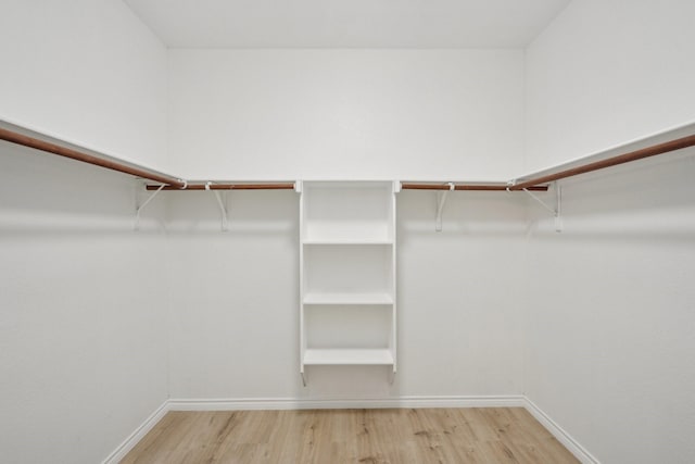 12350 Orloff Dr, Rhome, TX 76078 - walk in closet with wood finished floors