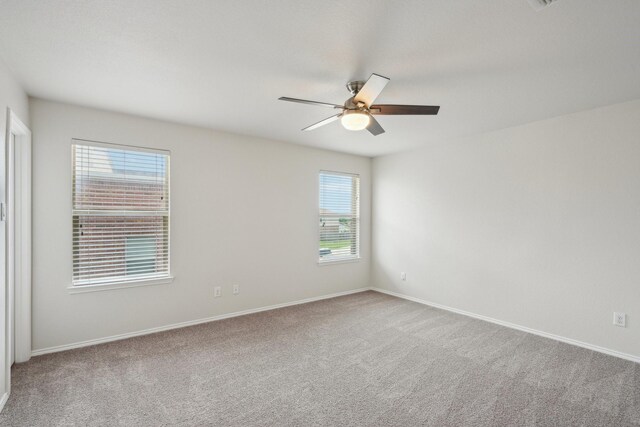 12350 Orloff Dr, Rhome, TX 76078 - spare room with a ceiling fan, carpet flooring, and baseboards