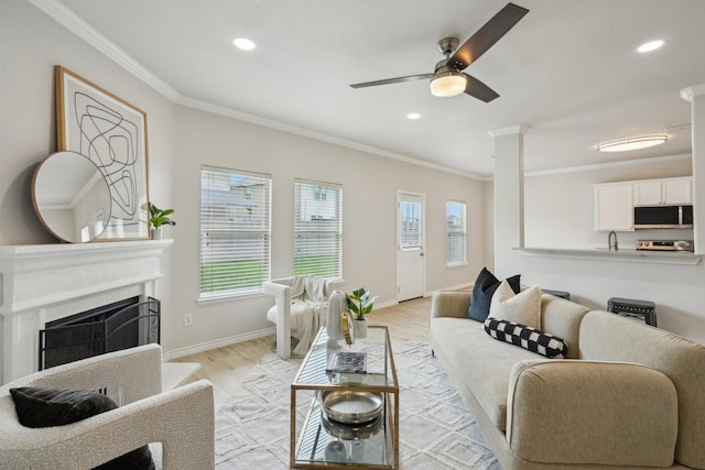 12350 Orloff Dr, Rhome, TX 76078 - living room featuring ornamental molding, plenty of natural light, light wood finished floors, ceiling fan, and recessed lighting