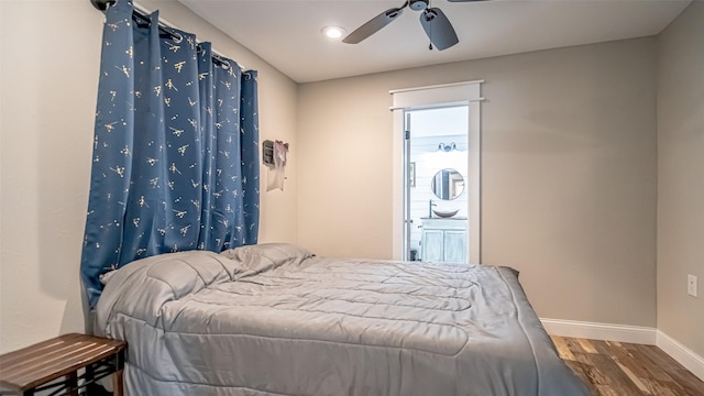 8147 Fawn Cir, Granbury, TX 76049 - bedroom featuring wood finished floors, baseboards, a ceiling fan, and ensuite bath