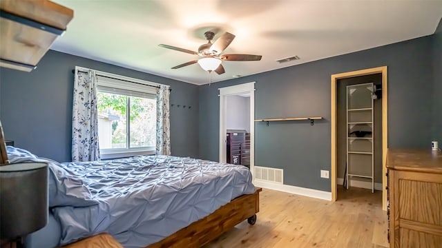 8147 Fawn Cir, Granbury, TX 76049 - bedroom with light wood-style floors, baseboards, and a ceiling fan