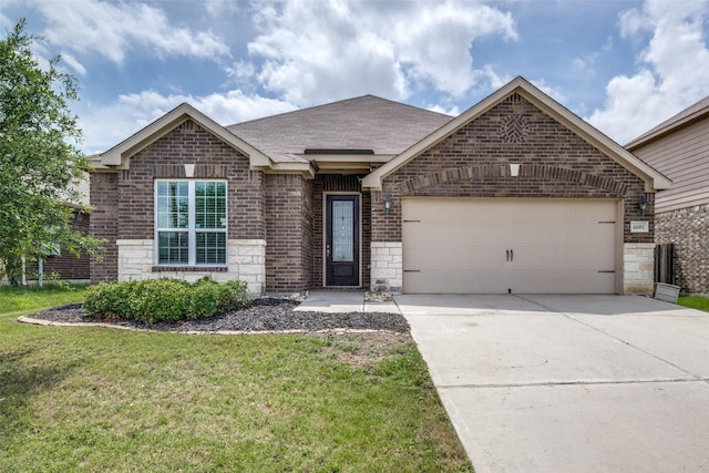 4601 Shy Creek Ln, Denton, TX 76207 - view of front facade with a garage, brick siding, driveway, a front yard, and stone siding