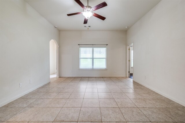 4601 Shy Creek Ln, Denton, TX 76207 - spare room with arched walkways, a ceiling fan, and light tile patterned flooring