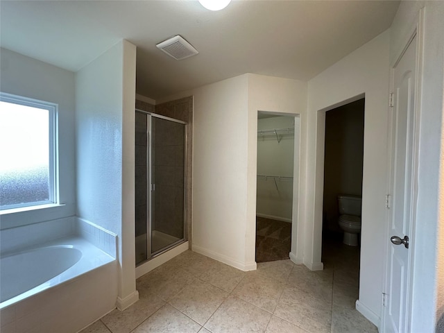 4601 Shy Creek Ln, Denton, TX 76207 - bathroom with a shower stall, toilet, tile patterned floors, a walk in closet, and a garden tub