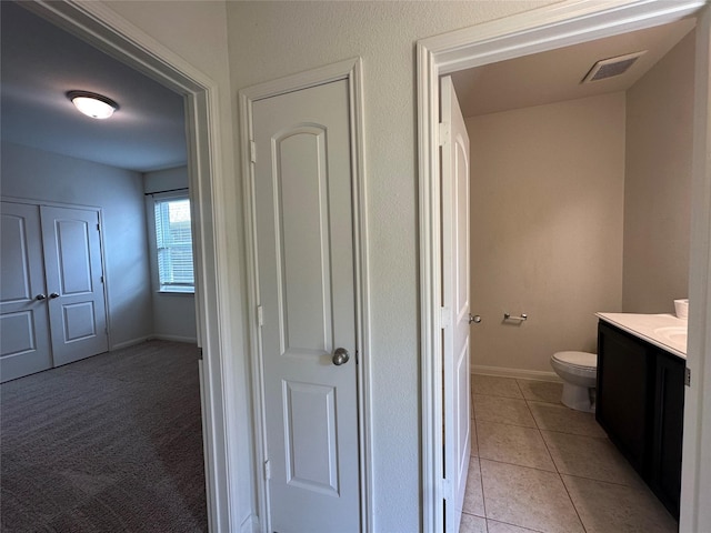 4601 Shy Creek Ln, Denton, TX 76207 - bathroom featuring toilet, vanity, baseboards, and tile patterned floors