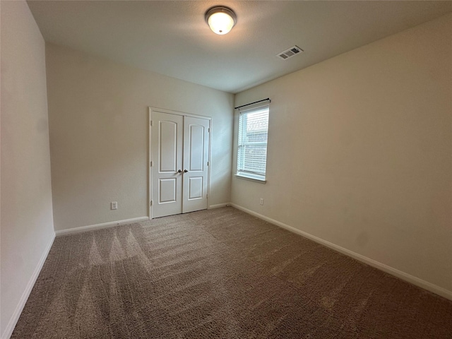 4601 Shy Creek Ln, Denton, TX 76207 - unfurnished bedroom with carpet floors, baseboards, and a closet