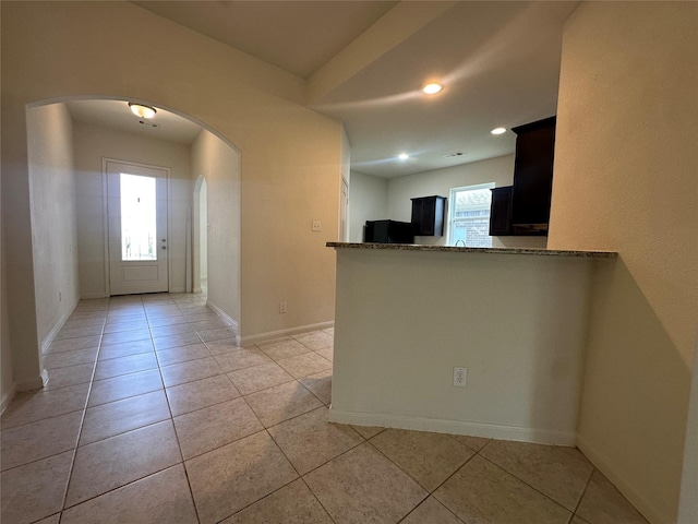4601 Shy Creek Ln, Denton, TX 76207 - foyer entrance with arched walkways, light tile patterned flooring, baseboards, and recessed lighting