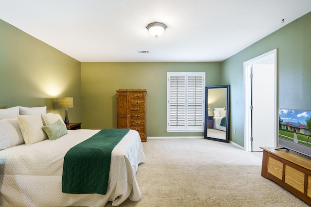bedroom with carpet flooring and baseboards