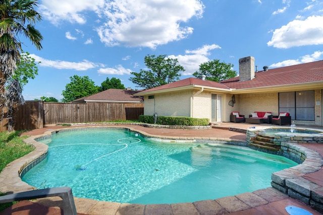 view of pool with a fenced backyard, a patio, and a pool with connected hot tub