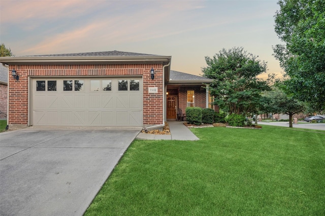 7552 Angel Trace Dr, Frisco, TX 75036 - ranch-style house with brick siding, driveway, a yard, an attached garage, and roof with shingles