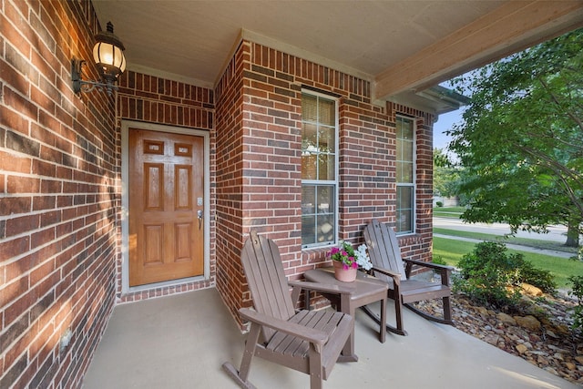 7552 Angel Trace Dr, Frisco, TX 75036 - view of exterior entry with a porch and brick siding
