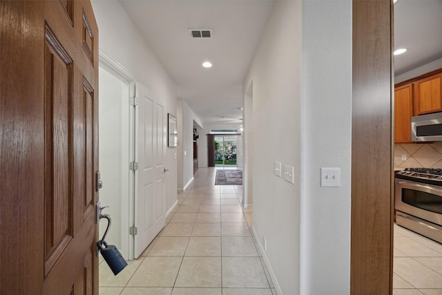 7552 Angel Trace Dr, Frisco, TX 75036 - hall with light tile patterned floors, recessed lighting, and baseboards