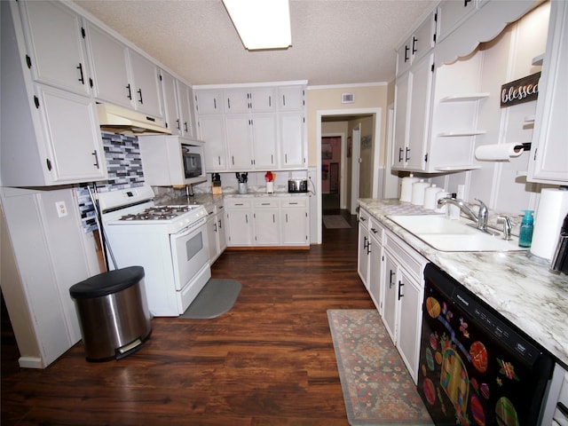 804 Austin Rd, Graham, TX 76450 - kitchen featuring white range with gas cooktop, dishwasher, under cabinet range hood, a sink, and dark wood-style floors