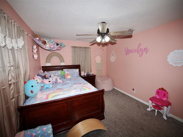 804 Austin Rd, Graham, TX 76450 - bedroom featuring carpet flooring, a textured ceiling, a ceiling fan, and baseboards