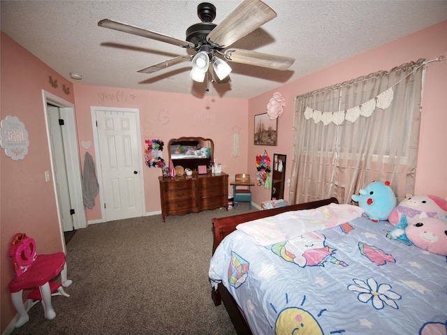 804 Austin Rd, Graham, TX 76450 - carpeted bedroom with a textured ceiling, ceiling fan, and baseboards