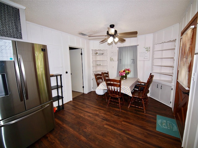 804 Austin Rd, Graham, TX 76450 - dining space featuring dark wood-type flooring, a textured ceiling, ceiling fan, and built in shelves